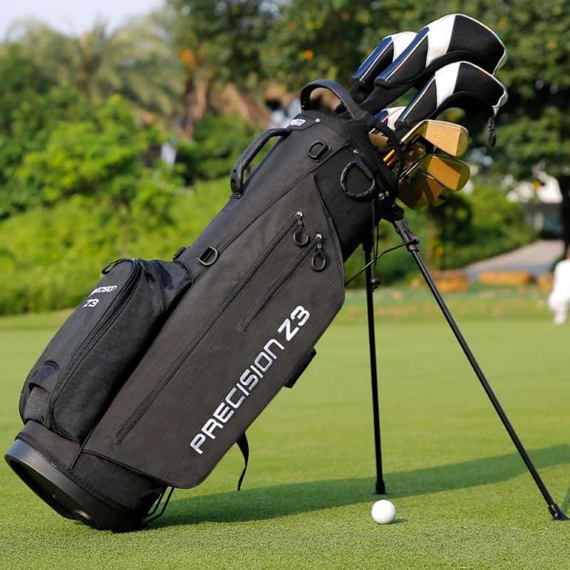 Precision Z3 golf bag on grass with clubs and ball; sleek black design, ready to play.
