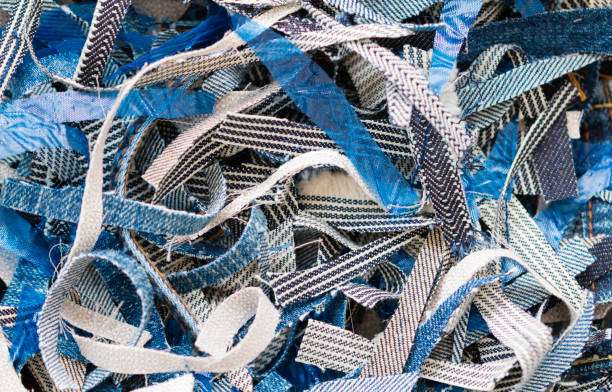 Textured blue and white fabric scraps, potential materials for custom golf bag craftsmanship.