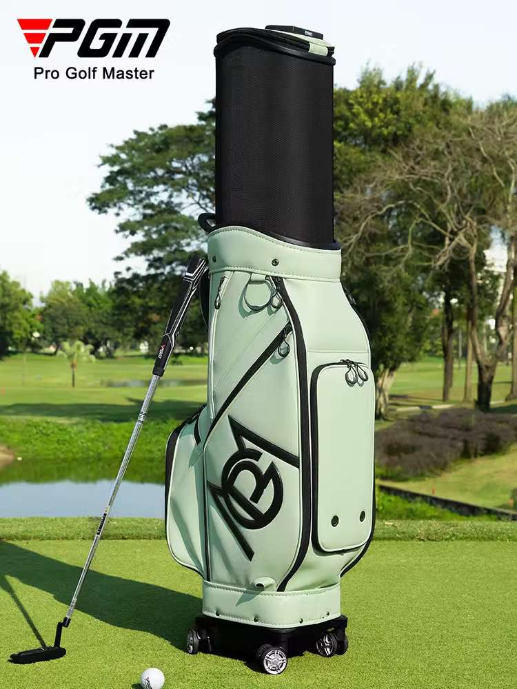 Modern light green PGM Golf Bag with wheels on a sunny golf course.